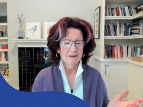 a therapist at a workshop, listening or taking notes